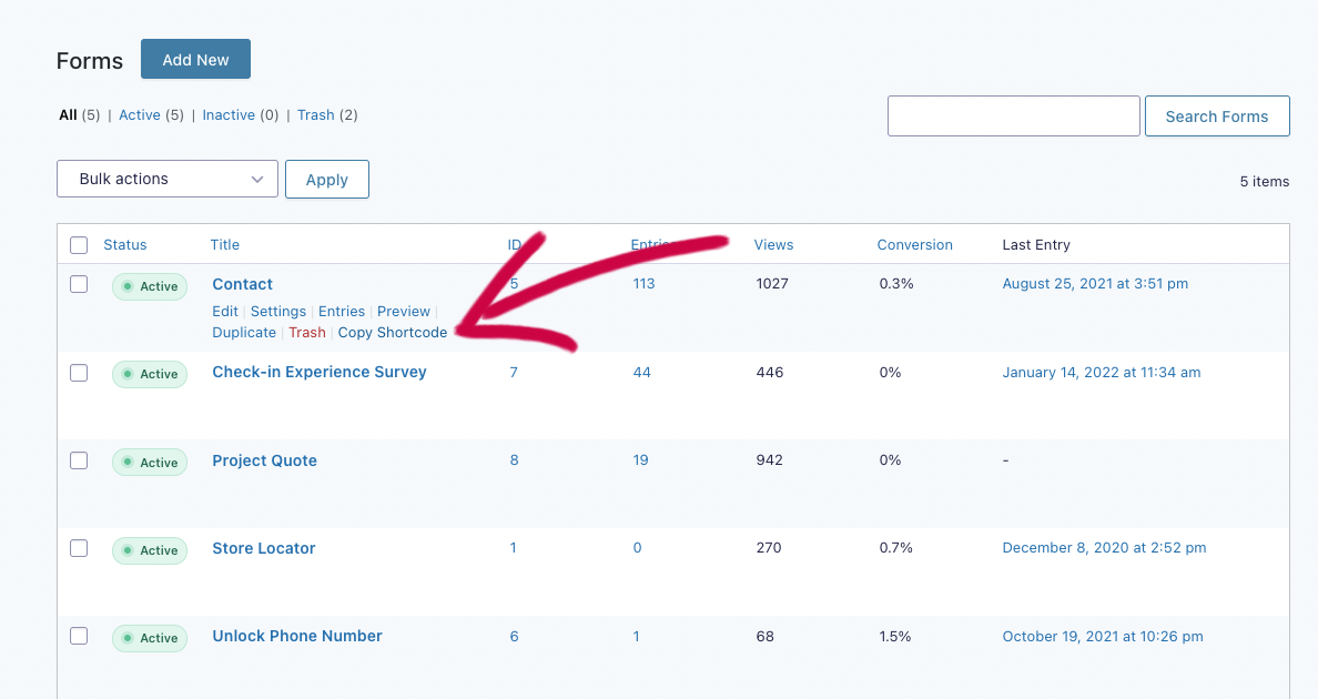 Screenshot of the Gravity Forms list of forms. An arrow points to an additional row action link below a form name labeled "Copy Shortcode."